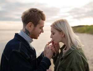 teen couple smoking weed in autumn