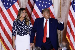 Former US President Donald Trump arrives to speak with former First Lady Melania Trump, left, at the Mar-a-Lago Club in Palm Beach, Florida, US, on Tuesday, Nov. 15, 2022.