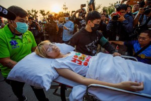 Hunger-striking activist Tantawan “Tawan” Tuatulanon being transported to Thailand's Supreme Court on Feb. 24​, where she continued to call for bail rights for political detainees. She was joined by Orawan "Bam" Phuphong in the hunger strike, which began