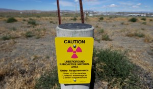 a sign warns of radioactive material stored underground on the Hanford Nuclear Reservation near Richland.