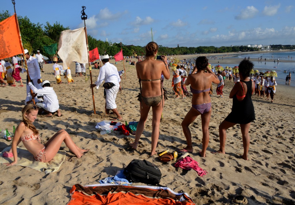 Bali has recently cracked down on misbehaving tourists who are working without proper visas, breaking traffic laws, and posing naked for photos at sacred sites. Photo: SONNY TUMBELAKA / AFP​