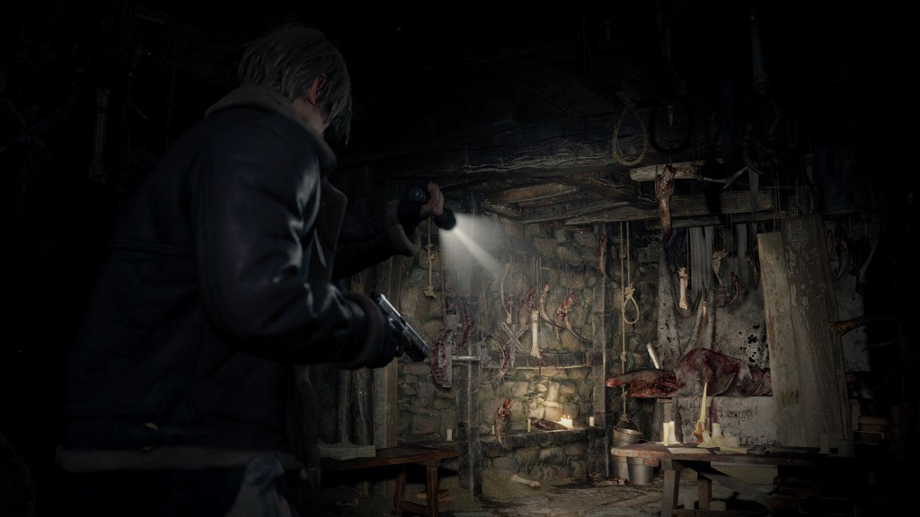 Leon Kennedy holds a handgun and flashlight as he investigates a messy basement, filled with traps, candles, and partially butchered animals.