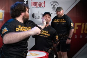 A competitor in a hat being slapped at SlapFight Championships