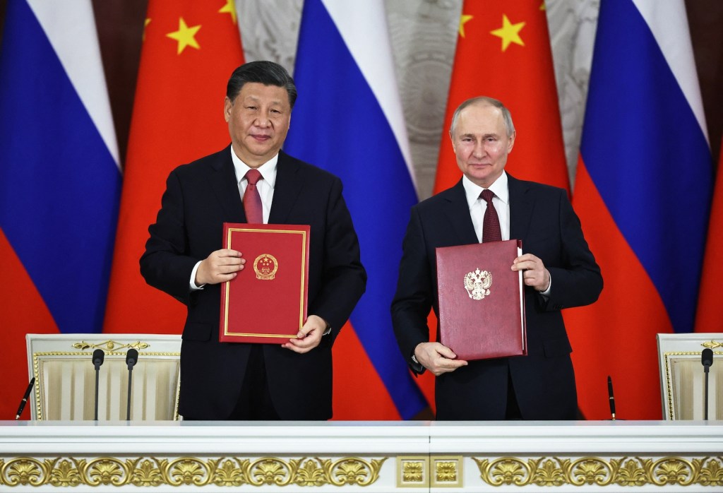 CHINESE PRESIDENT XI JINPING AND HIS RUSSIAN COUNTERPART VLADIMIR PUTIN MET IN MOSCOW. PHOTO: MIKHAIL TERESHCHENKO / SPUTNIK / AFP