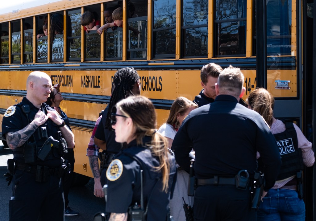 School buses with children arrive at Woodmont Baptist Church to be reunited with their families after a mass shooting at The Covenant School on March 27, 2023 in Nashville, Tennessee.