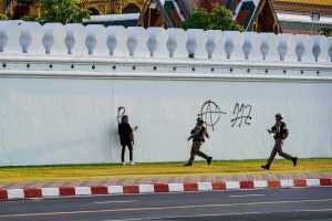 ​On Tuesday, a graffiti artist was arrested for spray painting anti-monarchy symbols on the Grand Palace, which traditionally housed the Thai royal family. Photo: Ginger Cat