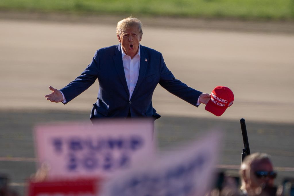 Former US President Donald Trump gestures as he arrives to speak during a 2024 election campaign rally in Waco, Texas, March 25, 2023. - Trump held the rally at the site of the deadly 1993 standoff between an anti-government cult and federal agents