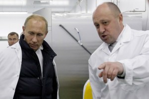 Businessman Yevgeny Prigozhin shows Russian Prime Minister Vladimir Putin his school lunch factory outside Saint Petersburg on September 20, 2010