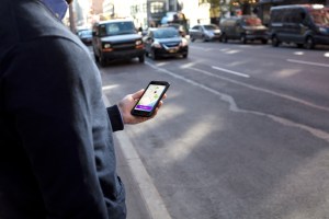 ​Man holding his phone.