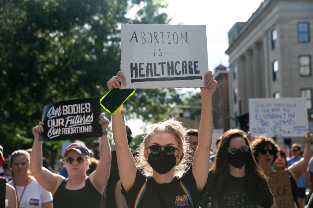 People gather to protest against the the Supreme Court's decision in the Dobbs v Jackson Women's Health case on June 24, 2022 in Raleigh, North Carolina.