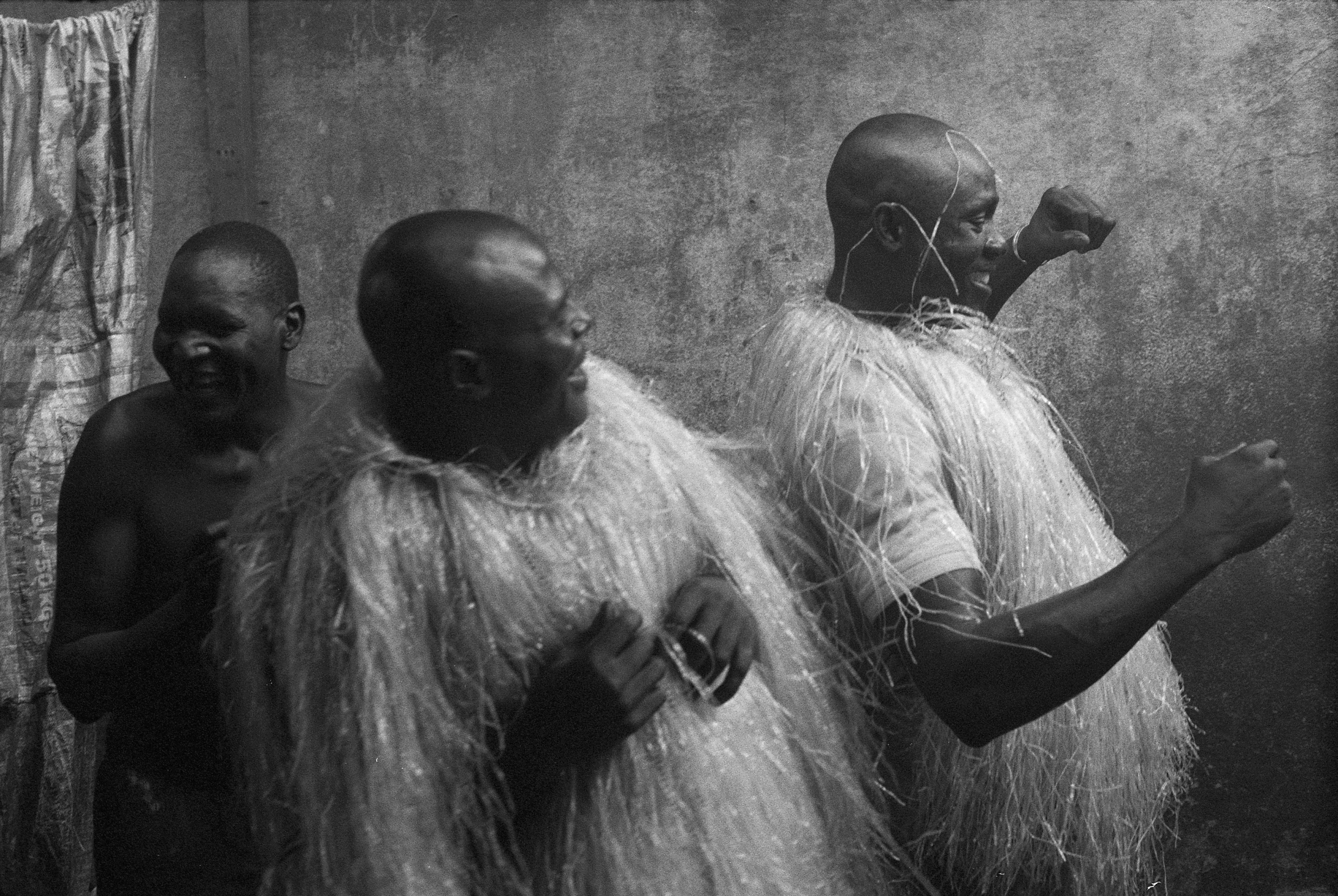 Macabo Gattè dancing in the kitchen of the prison a traditional dance from the south-west region of Cameroon. The costumes are hand made in prison by the dancers through shedding the plastic rice bags