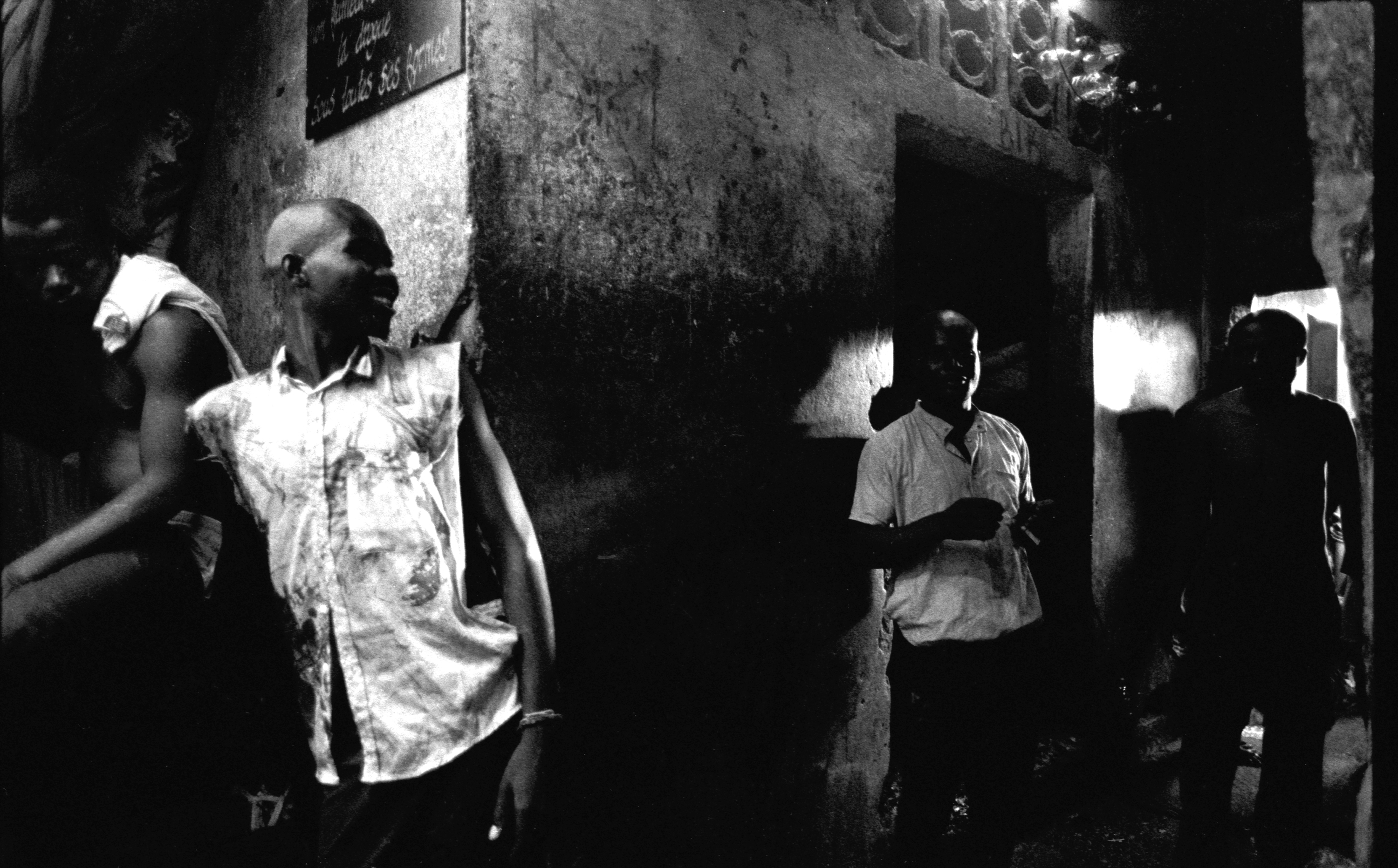 Some prisoners standing in a corridor leading to the Texas quarter of prison