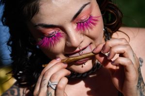 An attendee rolls a blunt during the Mile High 420 Festival in Denver, Colorado