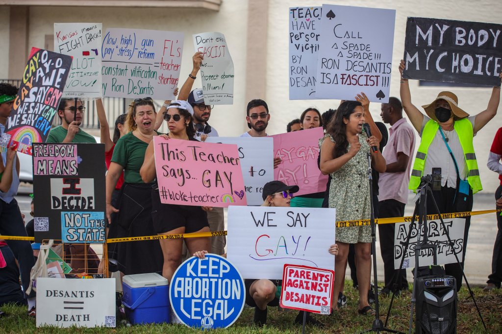 Protesters gathered outside the Metro-Dade Firefighters Local 1403 as Gov. DeSantis spoke at event for pro-DeSantis school board candidates in Doral, Florida, August 21, 2022.