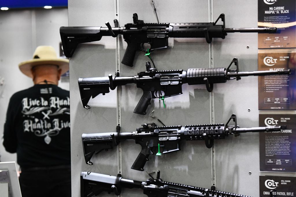 Colt M4 Carbine and AR-15 style rifles are displayed during the National Rifle Association (NRA) Annual Meeting at the George R. Brown Convention Center, in Houston, Texas on May 28, 2022