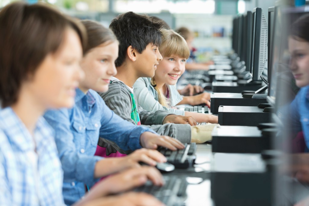 A photo of school children on computers