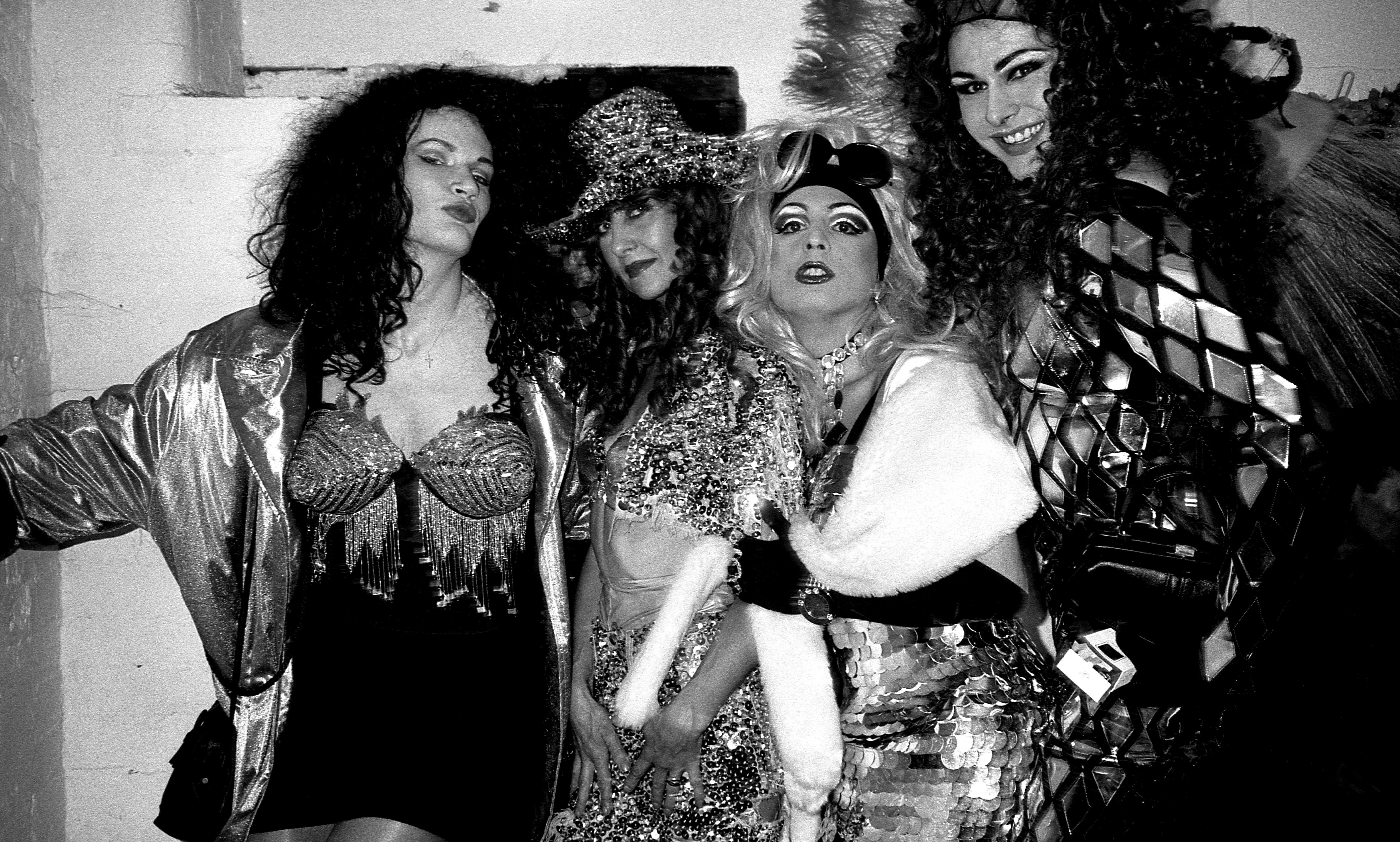 A group of drag queens pose for the camera inside the Hacienda club.