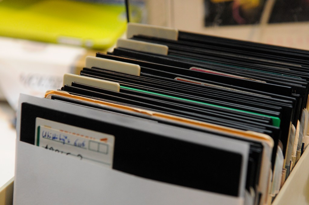 A box full of labeled 5" floppy disks