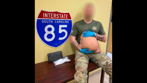 ​The fake pregnancy belly being held by a local police officer.