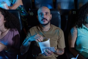 man watching a film in a cinema