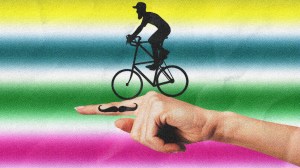 A man on a fixie riding off a finger with a moustache tattoo