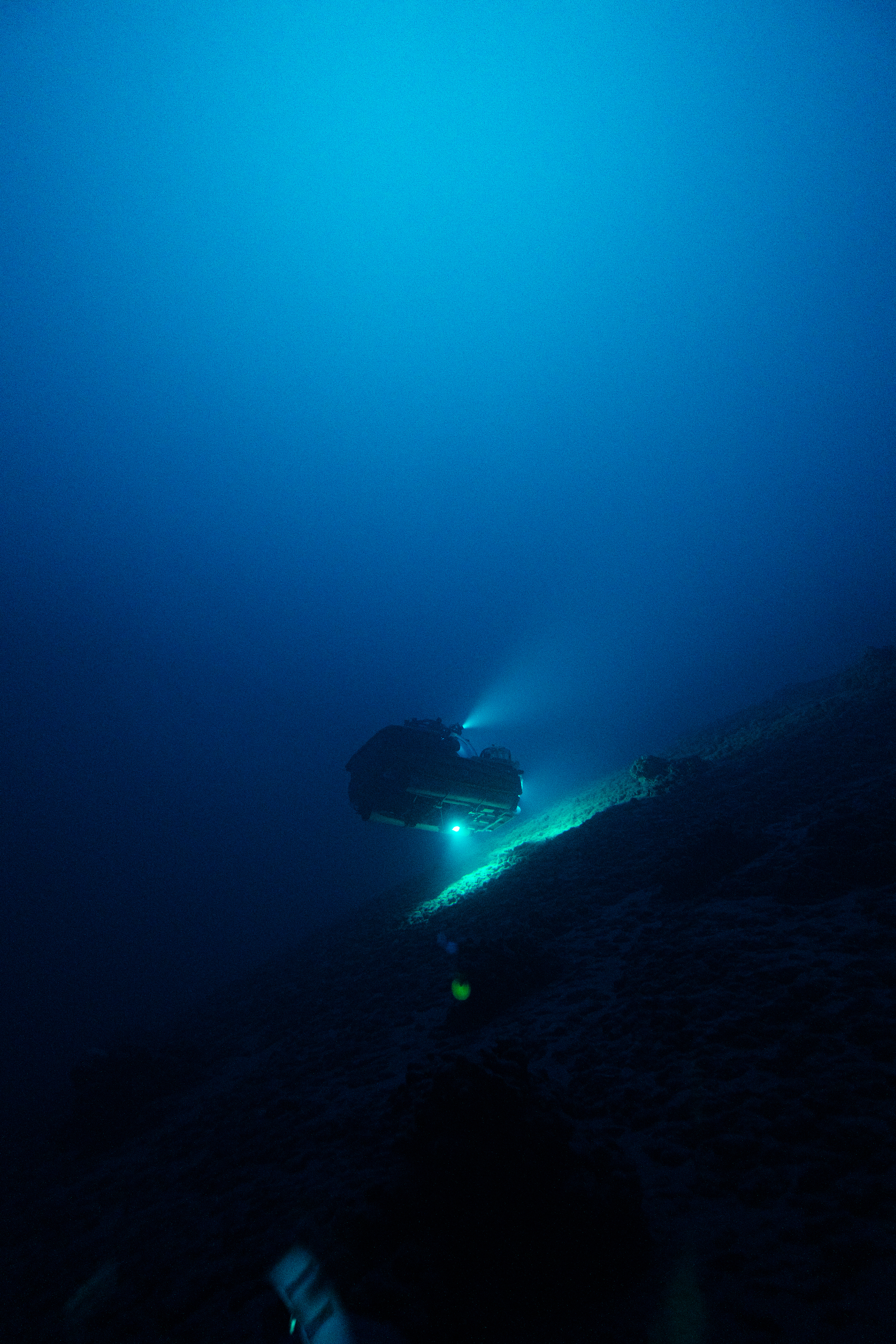 A submersible lighting up the ocean floor