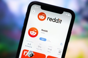 Reddit app on a phone screen. Getty Images