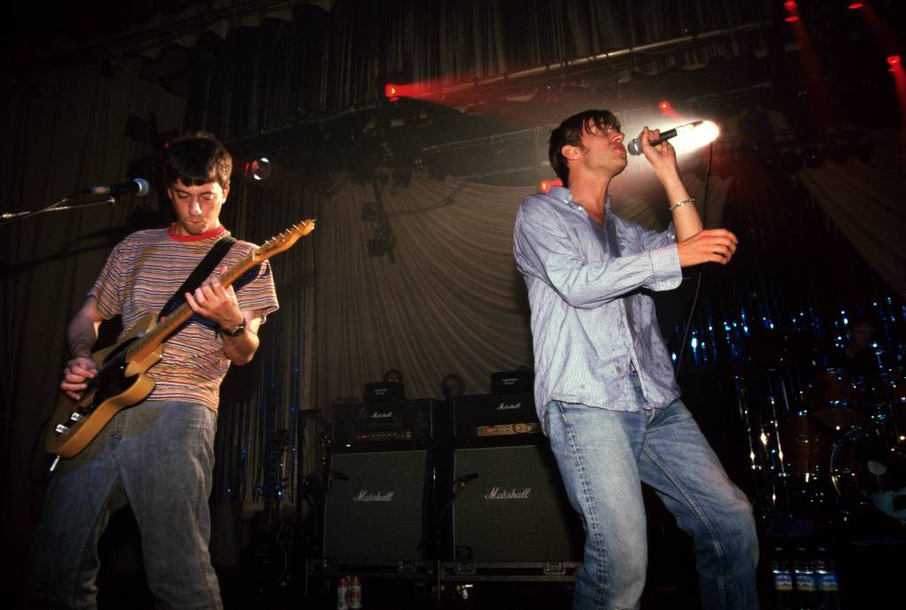 ​Graham Coxon and Damon Albarn of Blur performing in the 90s