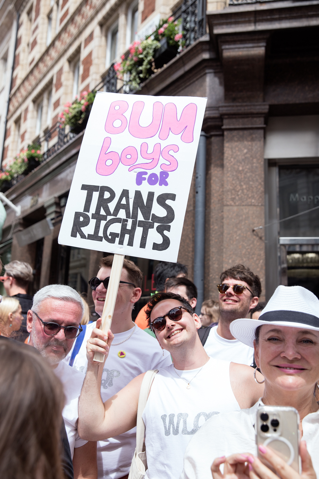 London Pride 2023: Attendee holds sign reading Bum Boys For Trans Rights