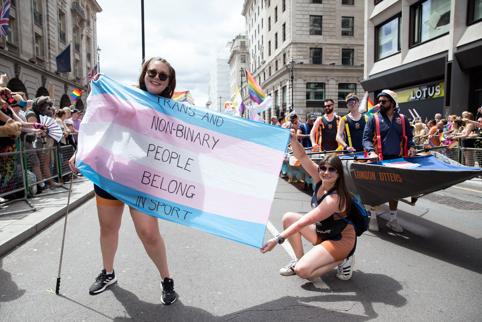 London Pride 2023: Marchers hold up flag reading Trans People Belong in Sport