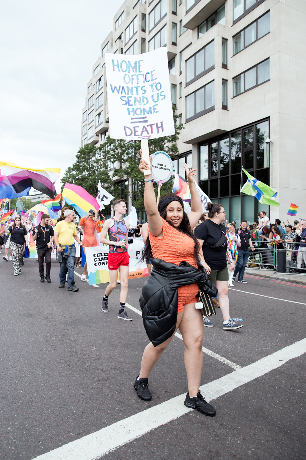 London Pride 2023: Marcher holds up sign reading Home Office Wants to Send Us Home = Death