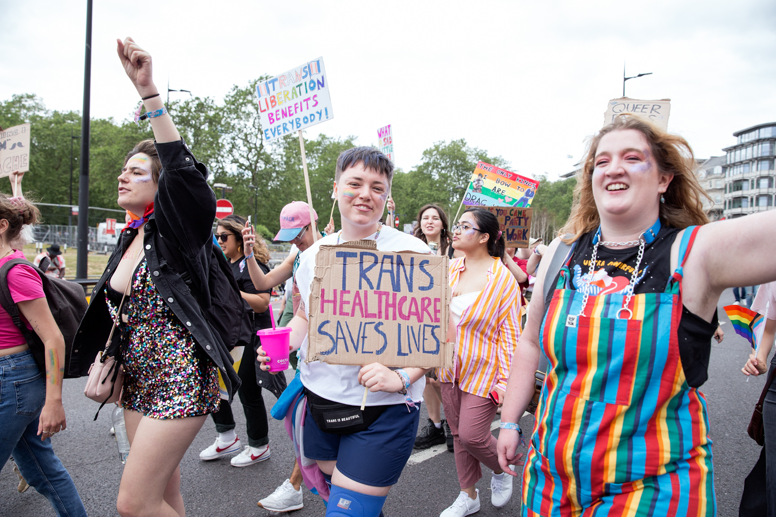 London Pride 2023: Marchers hold sign reading Trans Healthcare Saves Lives