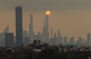 Orange sun over NYC skyline July 19