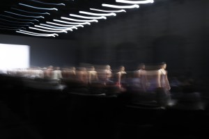 A fashion show of people on a runway