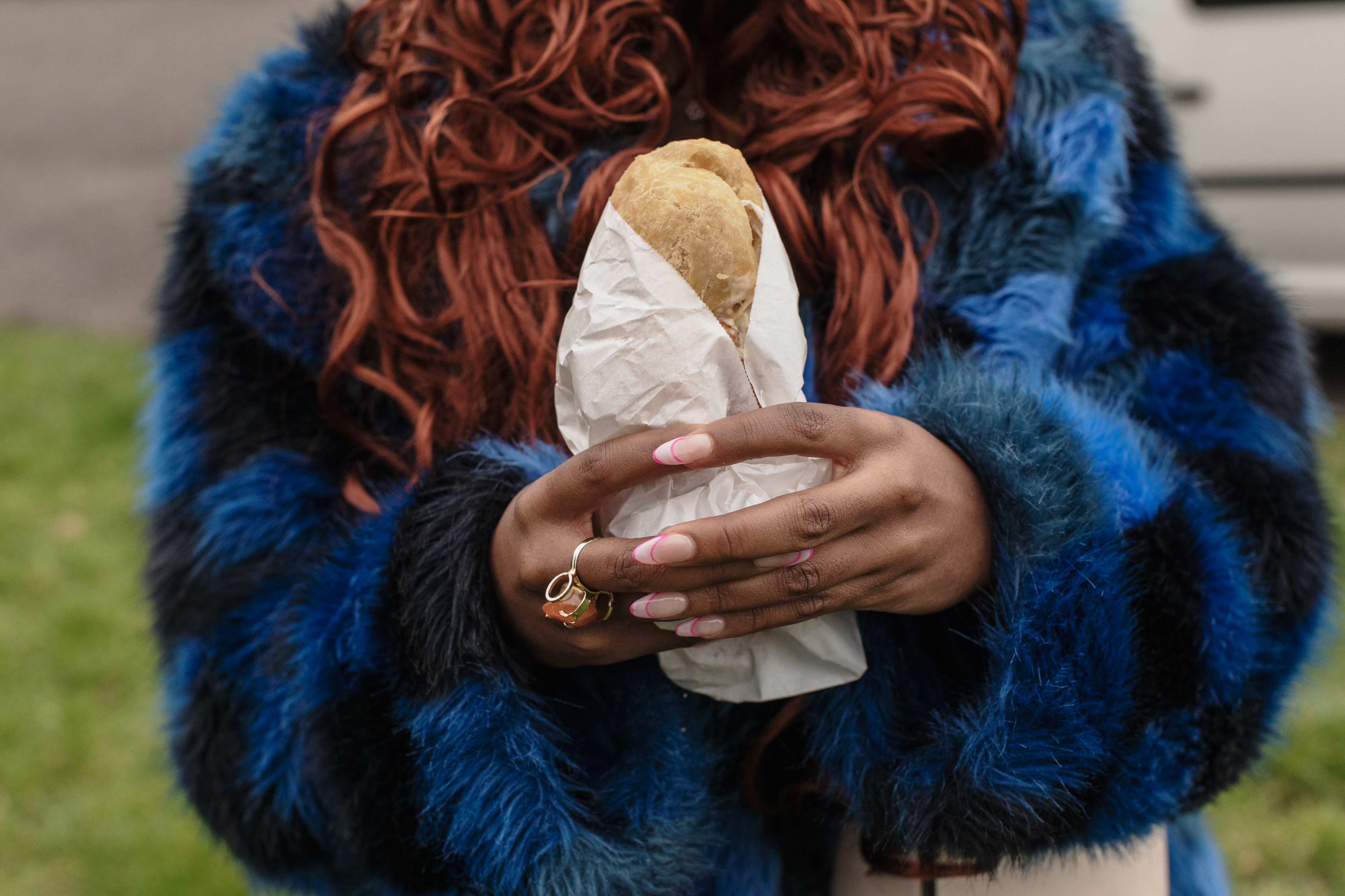 Manchester, UK: Kemi Alemoru holds a chicken sandwich from Chicken Run