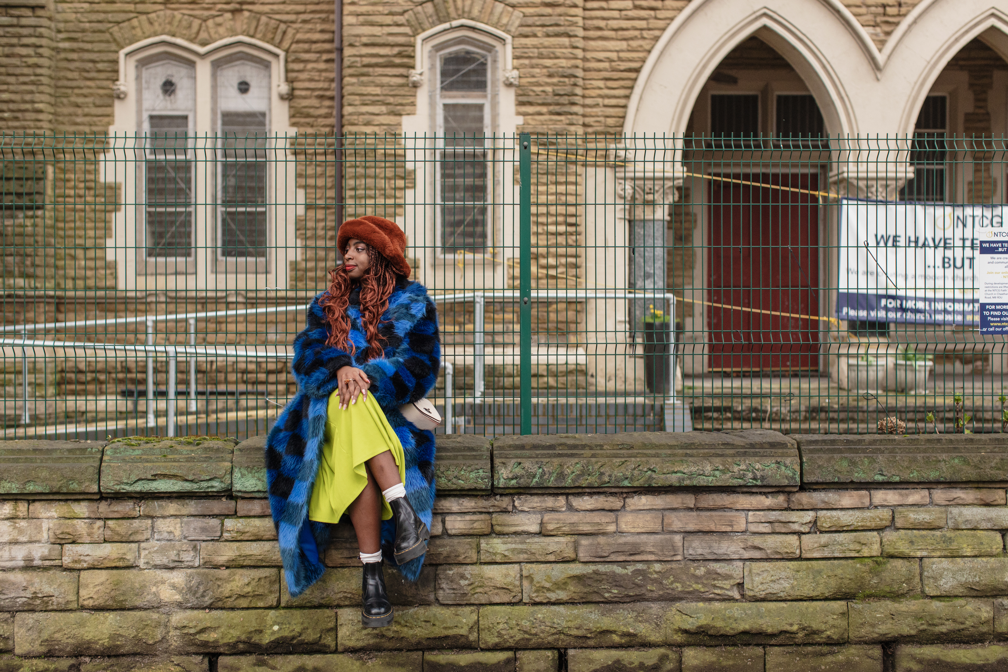 Manchester, UK: Kemi Alemoru sat on a wall