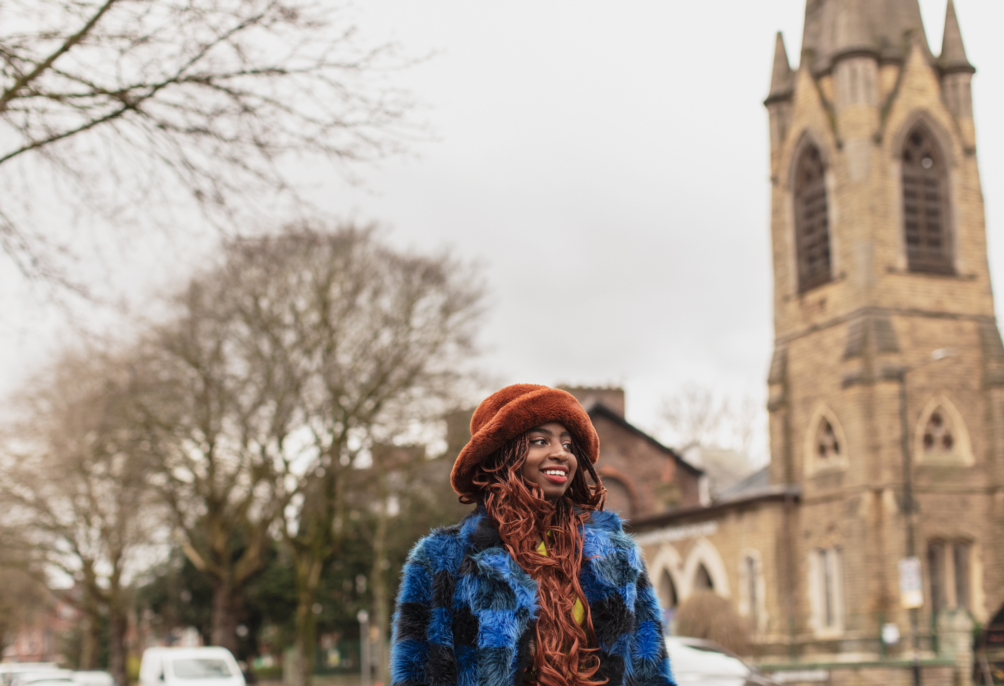 Manchester, UK: Kemi Alemoru in front of a church