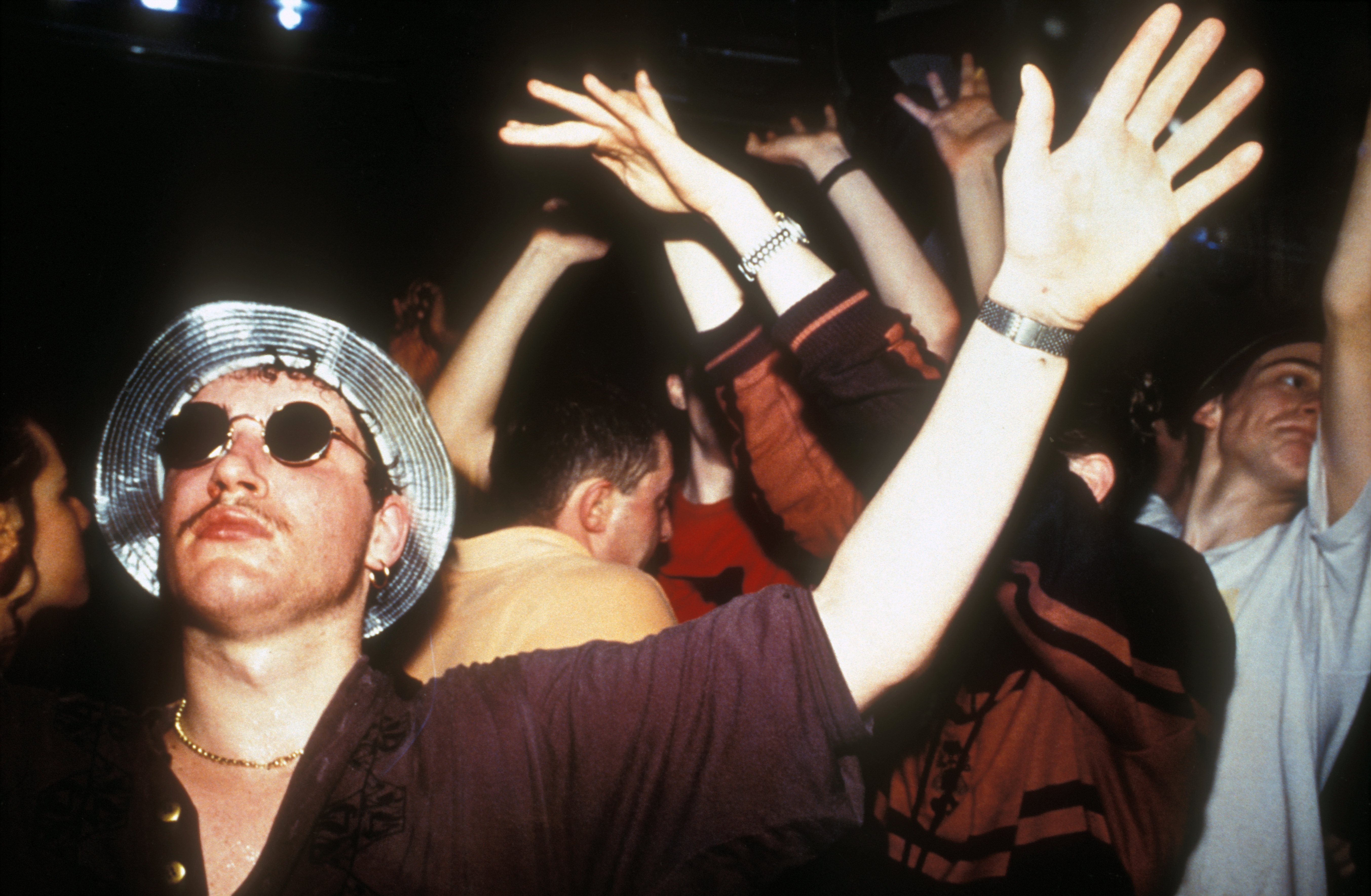 Clubbers dancing at Amnesia Rave 1991. (Photo by Tony Davis/PYMCA/Avalon/Getty Images)