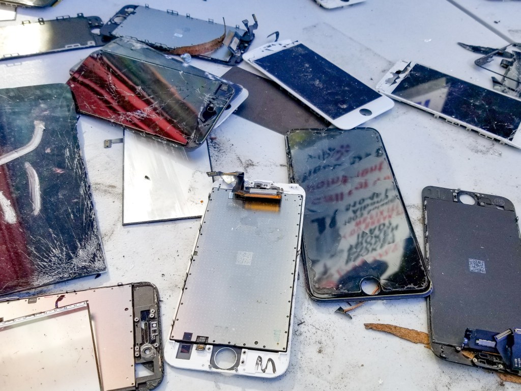 A stack of broken phones