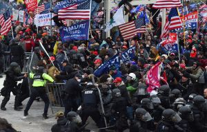 Trump supporters clash with police and security forces as they push barricades to storm the US Capitol in Washington D.C on January 6, 2021.