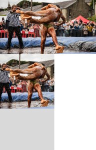 world gravy championships - a photo of two men wrestling in a gravy filled wrestling ring.