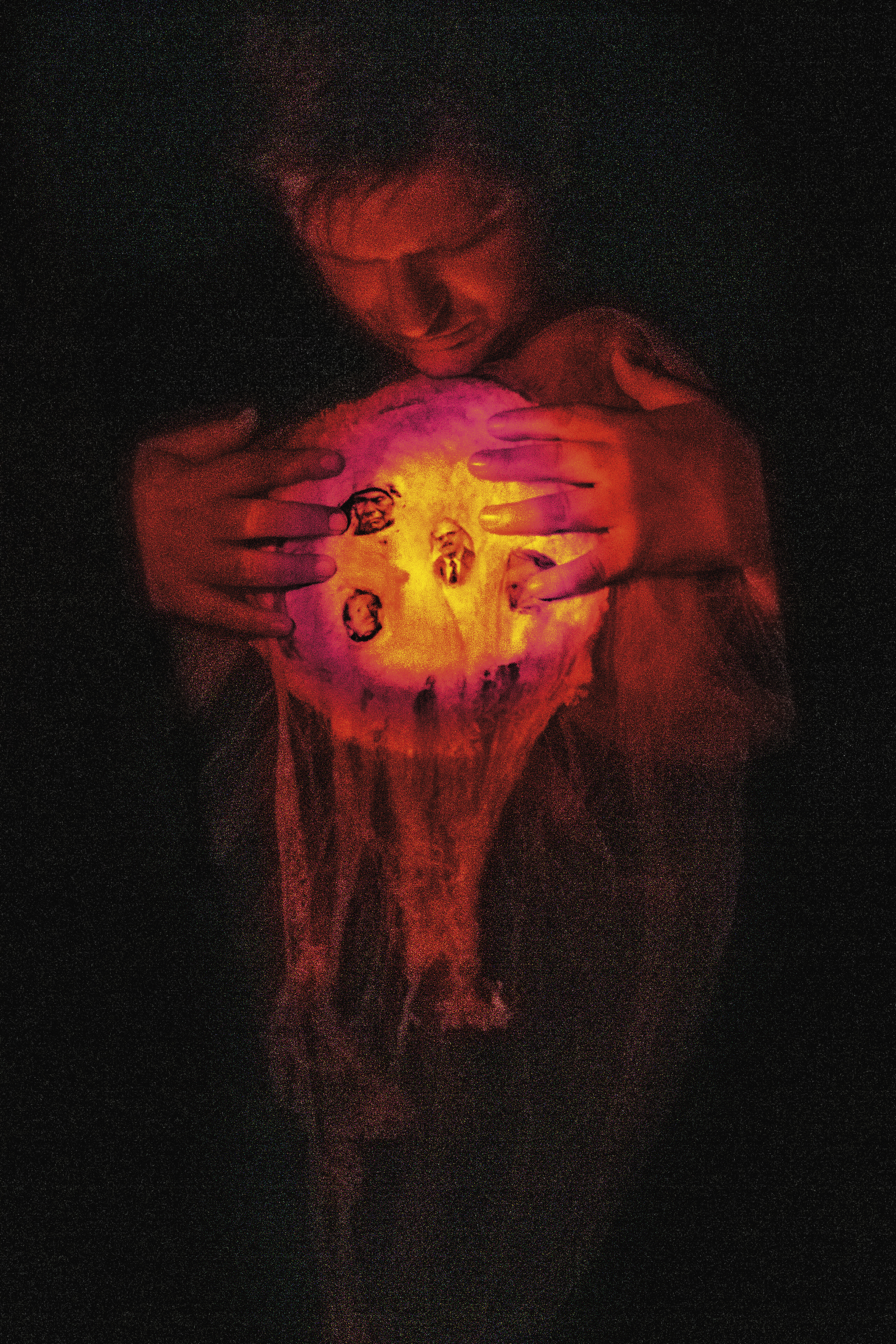 Medium Kai Muegge displays ectoplasm filled with images of the dead. Switzerland, 2018