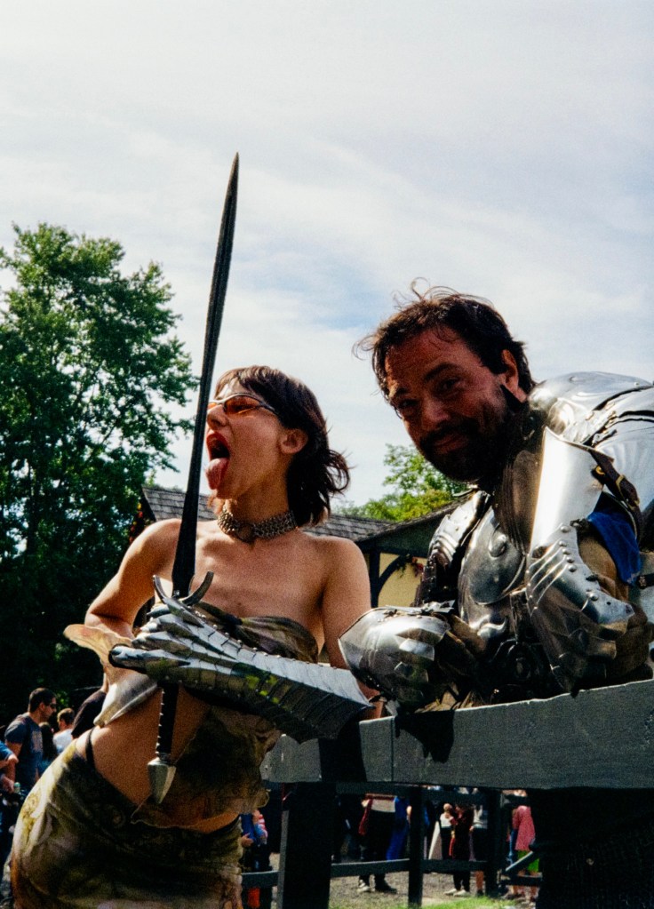 woman Holding Knight Sword at renassiance faire in new york