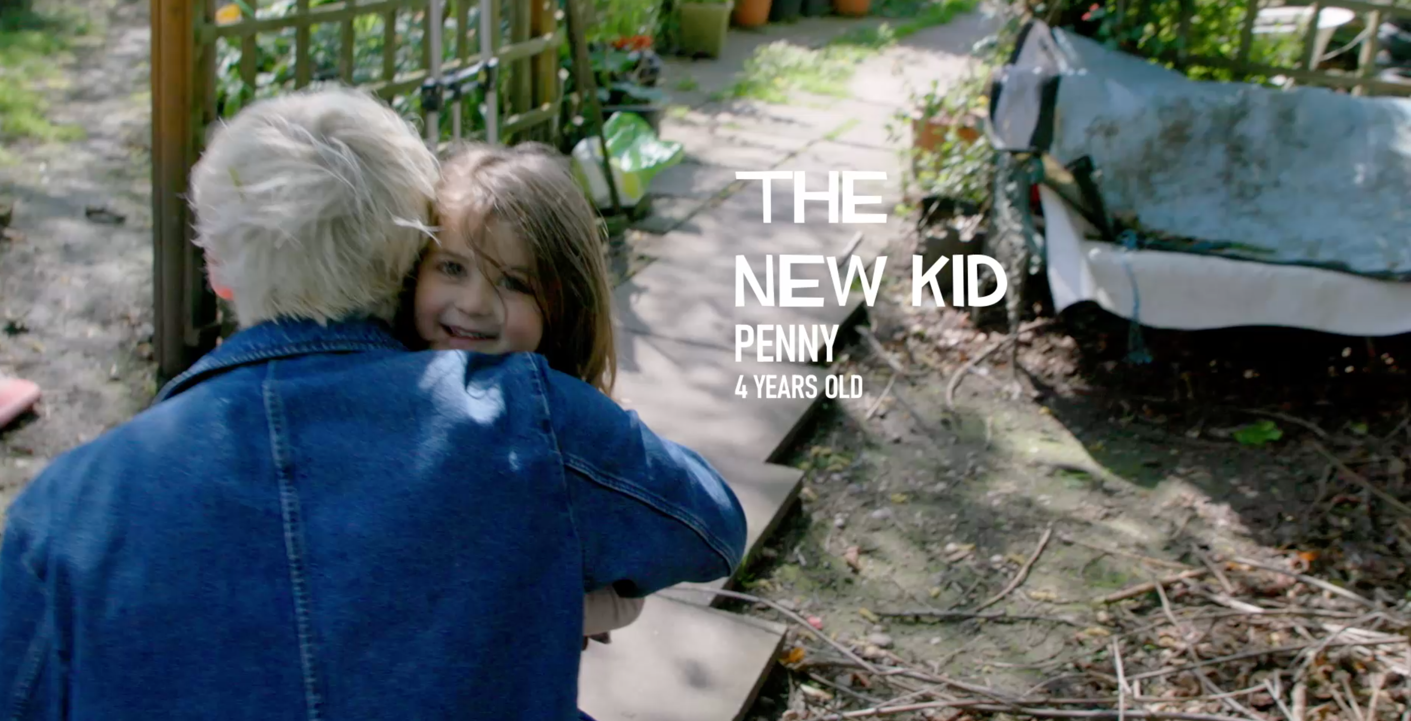 The author of the article hugs his 4-year-old niece in the back garden.