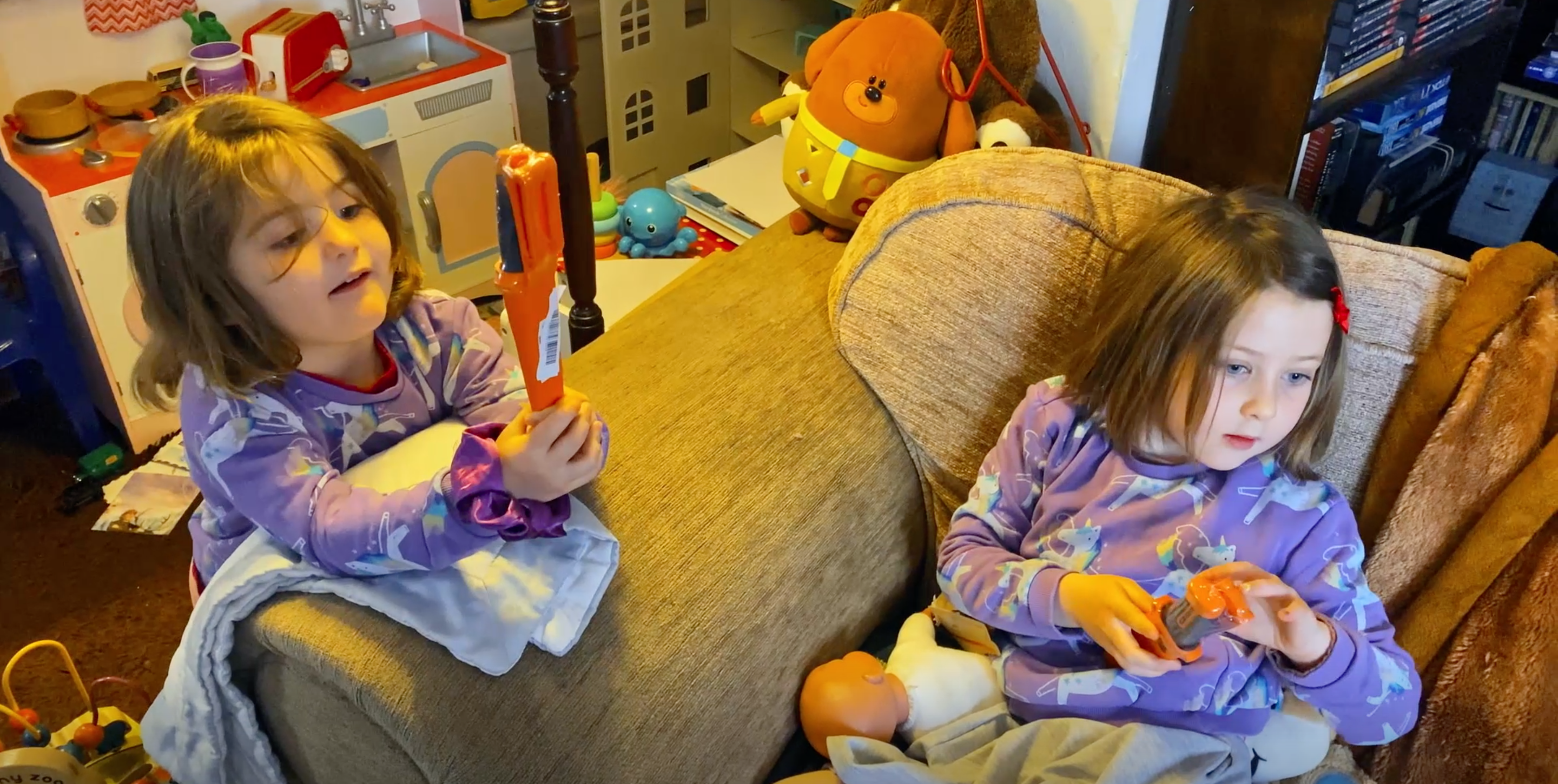 Two young children playing with carpenter knives bought from Amazon.