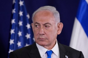 Israeli Prime Minister Benjamin Netanyahu looks on as the US Secretary of State gives statements to the media inside The Kirya, which houses the Israeli Defence Ministry, after their meeting in Tel Aviv on October 12, 2023.