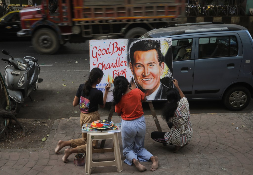 Students paint a portrait to pay tribute to late Actor Matthew Perry following his death, outside an art school in Mumbai, India, 29 October, 2023.