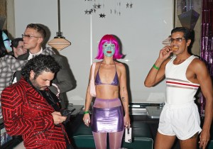 A woman in painted face at a Halloween party