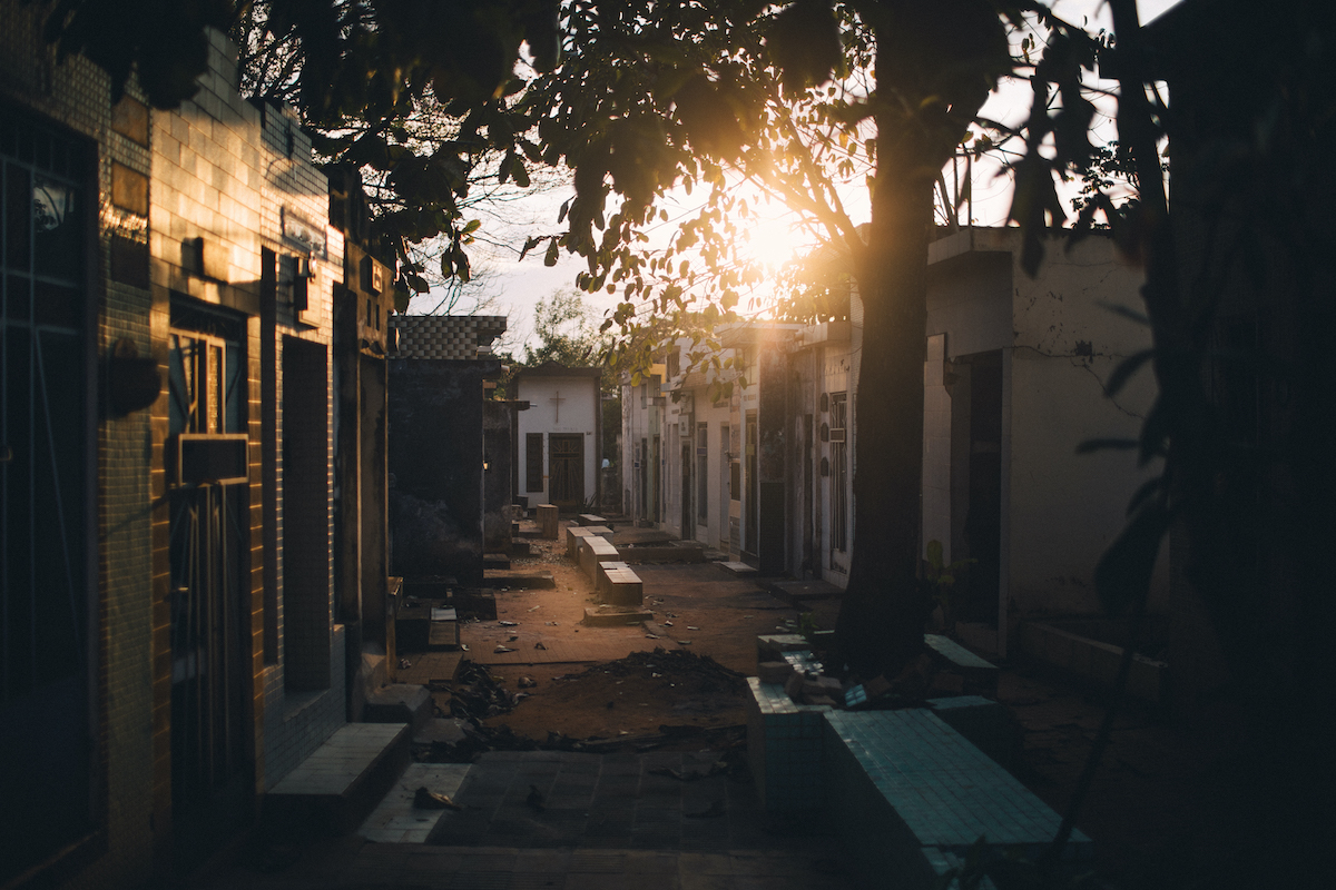 A photo of rows of vertical tombs during golden hour