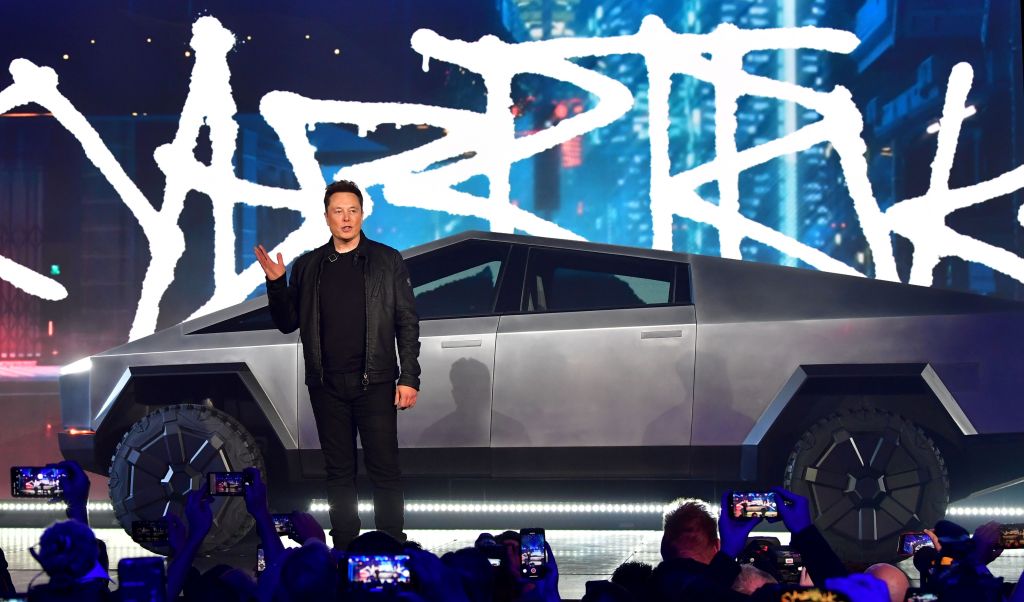 Elon Musk standing in front of the Cybertruck